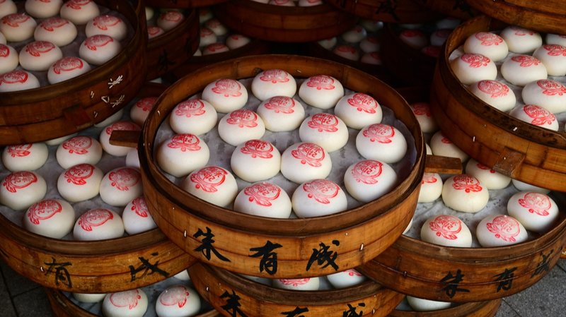 Petits pains estampillés en rouge suscitent la prospérité dans le Nouvel An de Jinhua