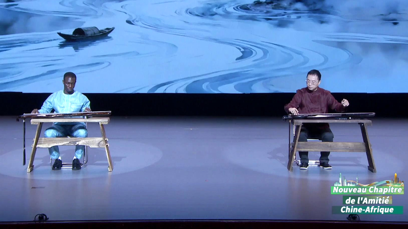 Maître de Guqin Chinois et Étudiant Togolais Harmonisent les Cultures video poster